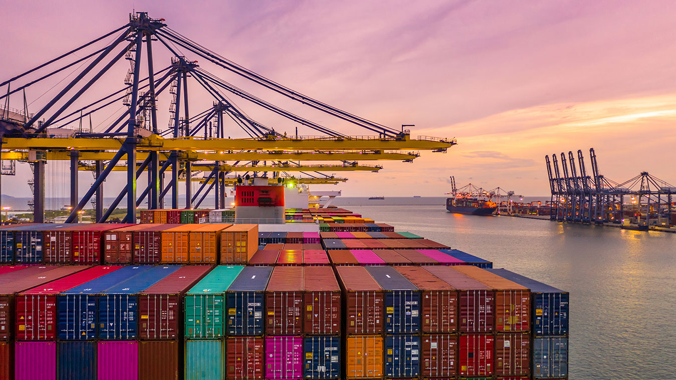 container-ship-loading-and-unloading-in-deep-sea-port-at-sunset-aerial-view-of-business-logistic-import-and-export-tcnltda